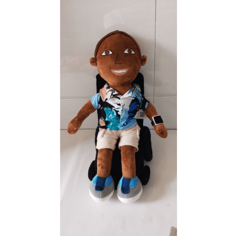 Budsies Selfies plush doll seated in a custom plush wheelchair