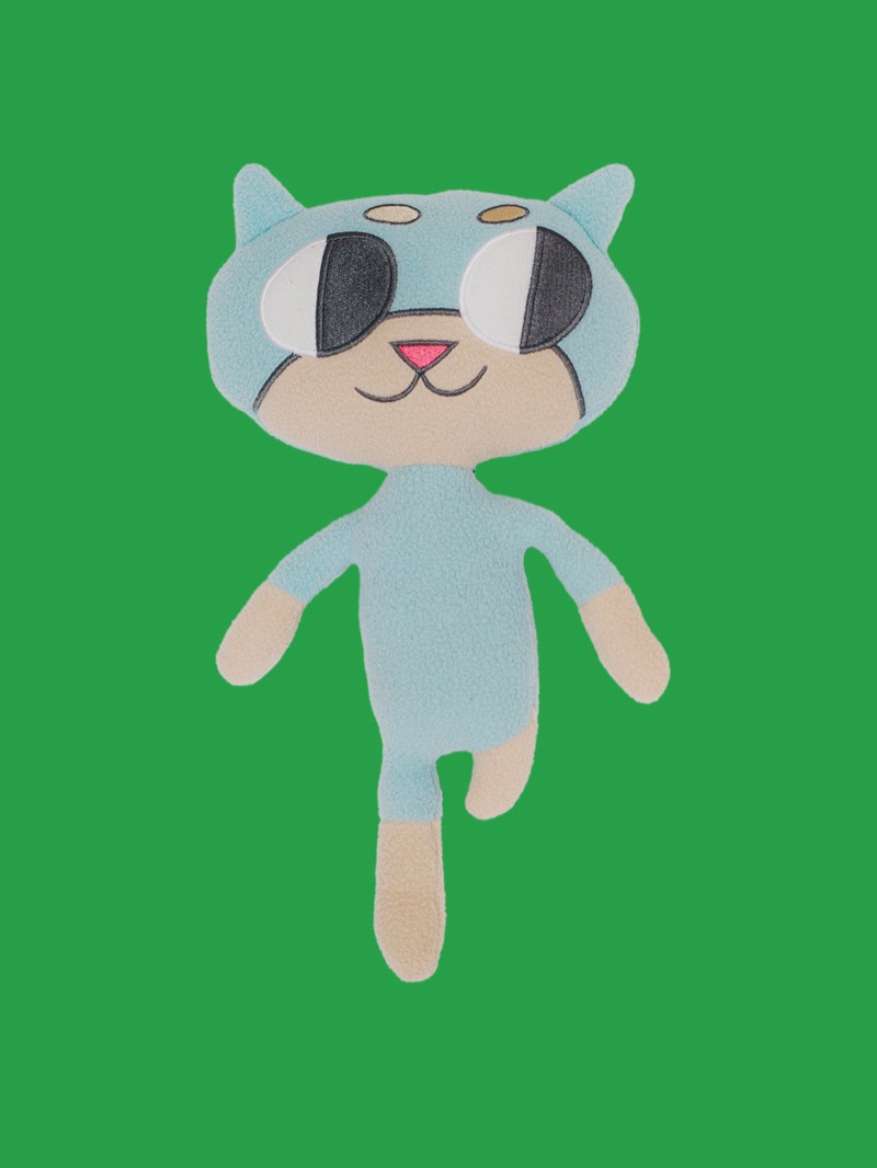 Lou the Cat plush from Mayana and Friends, with an above-the-knee limb difference