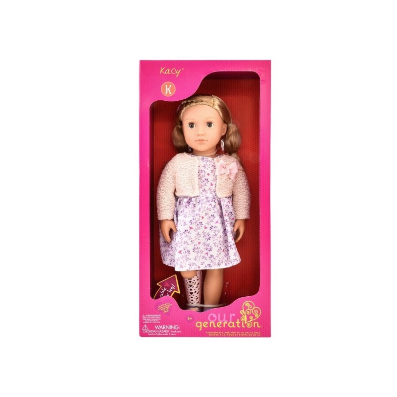 Our Generation Kacy doll in packaging, with a prosthetic leg
